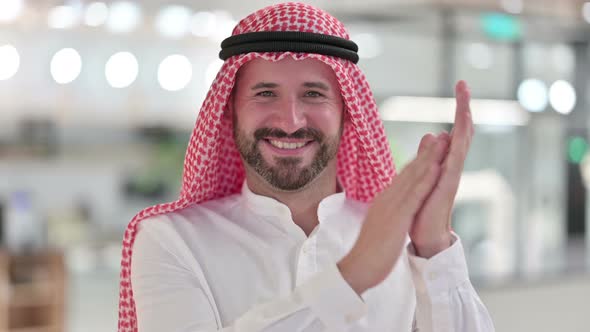 Excited Arab Businessman Clapping, Cheering 