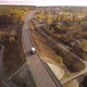 White Truck with Cargo Semi Trailer Moving on Autumn Road in Direction. - VideoHive Item for Sale