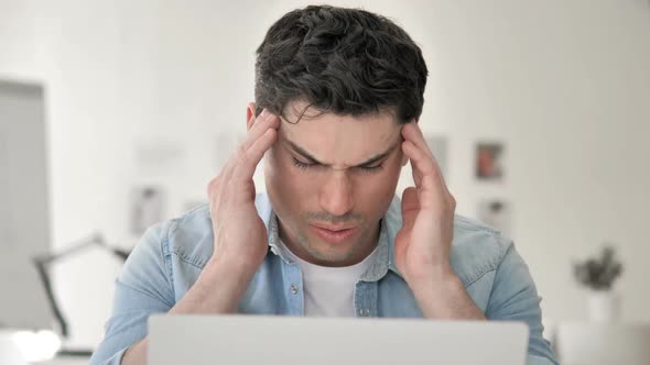 Stressed Casual Young Man with Headache