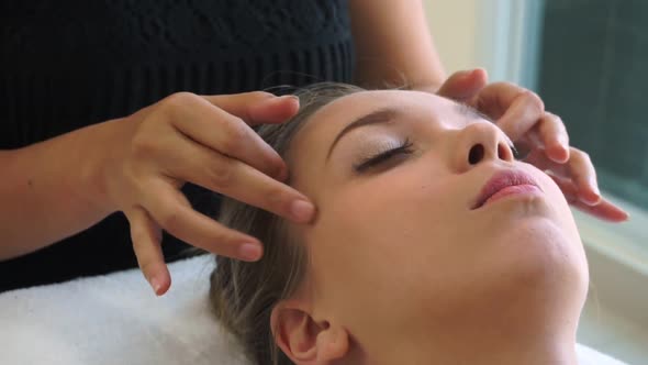 Woman Gets Facial and Head Massage in Luxury Spa