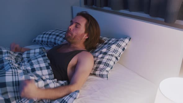 Frustrated Young Caucasian Man Having Sleeping Problem