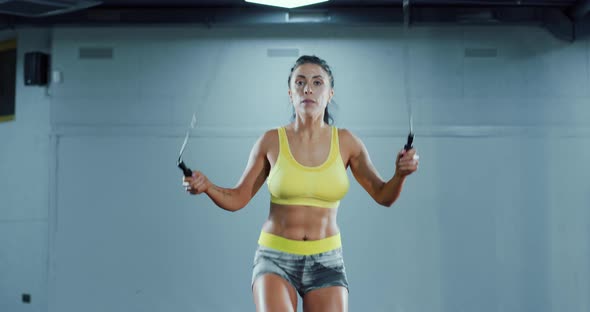 Athletic Woman Using Skipping Rope