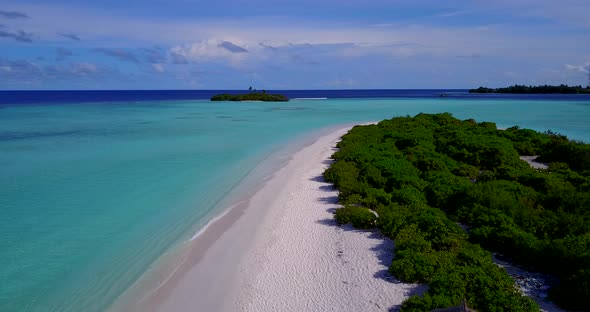 Wide drone copy space shot of a white paradise beach and blue sea background 