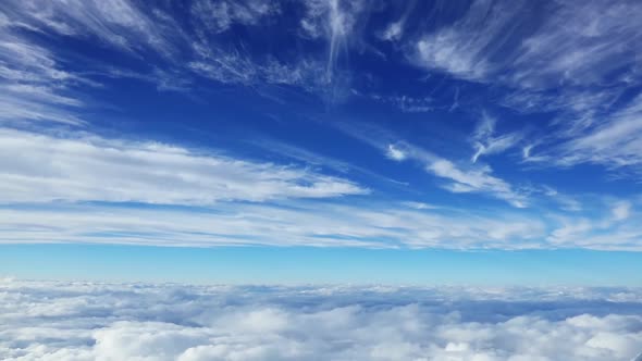 View From the Plane to the Sky with Clouds