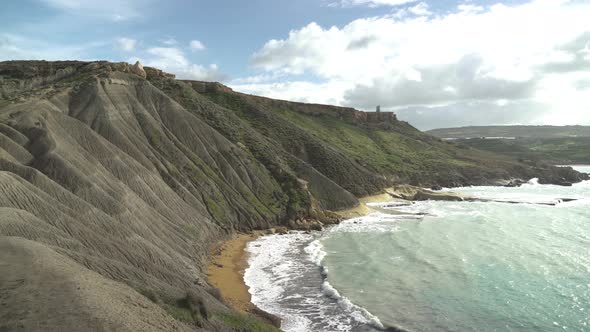 Steep and Big Hills with Mediterranean Sea Splashing Waves on Qarraba Bay Beach