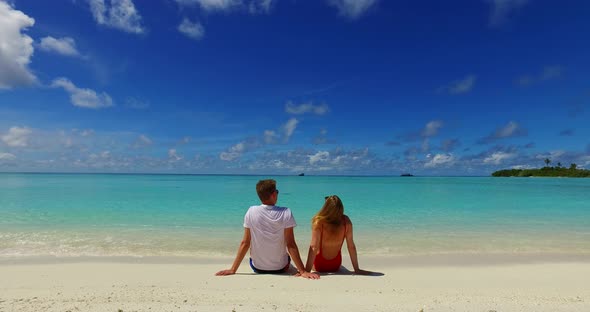 Happy people in love dating on vacation have fun on beach on summer white sandy 