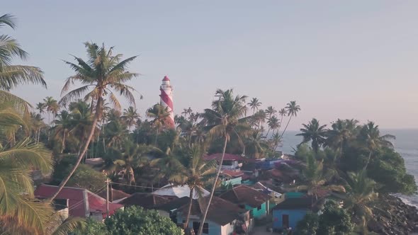 Thangassery Lighthouse at sunset, Kerala, India. Aerial drone view