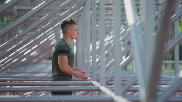 Sportive man at an outdoor gym