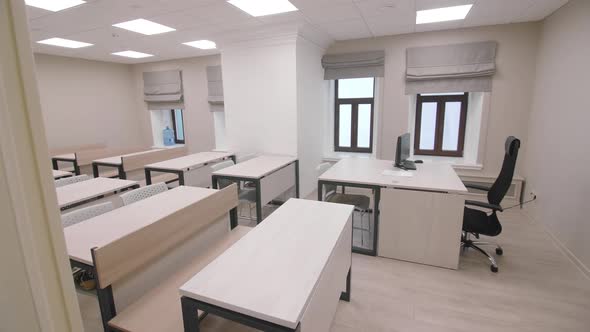 Teacher Workplace and Student Desks in Empty Classroom alt