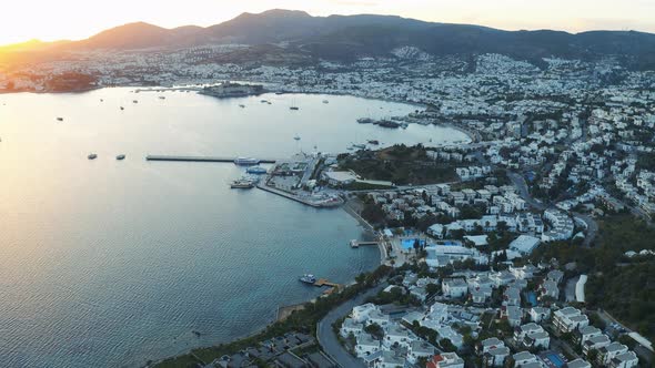 Bay in the Aegean Sea in the Rays of Sunset. Bodrum, Turkey. Aerial Footage