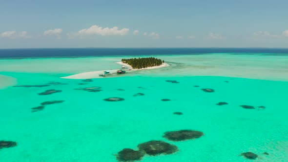 Tropical Island with a Beach on the Atoll