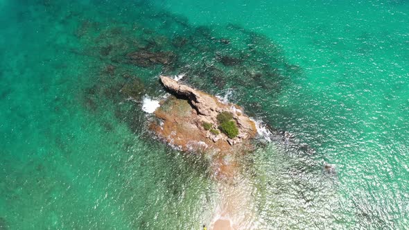 Aerial Top View Above Small Island At Yanui Beach