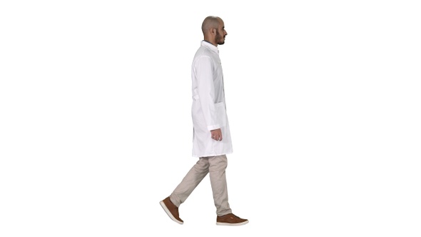 Arabian doctor in white robe walking on white background.