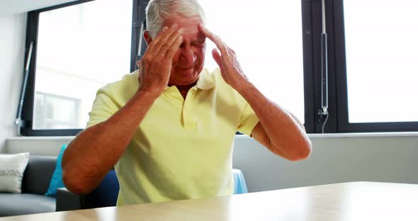 Senior man having headache
