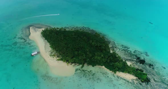 Drone Circle Top Shot Lonely Island in Turquoise Water Boat Goes Around