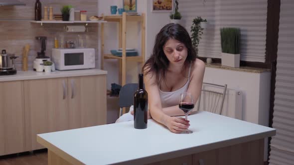 Depressed Woman Drinking Alone