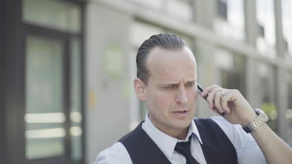 Businessman discussing business on cell phone