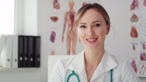 Handheld view of young female doctor in her office