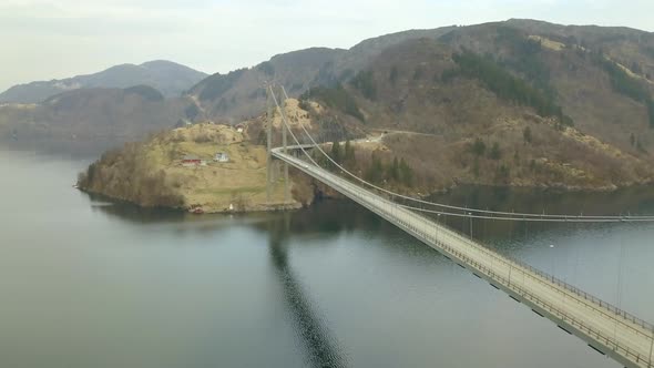 Drone Shot Flying Next to a Massive Suspension Bridge in Bergen, Norway Over a Fjord