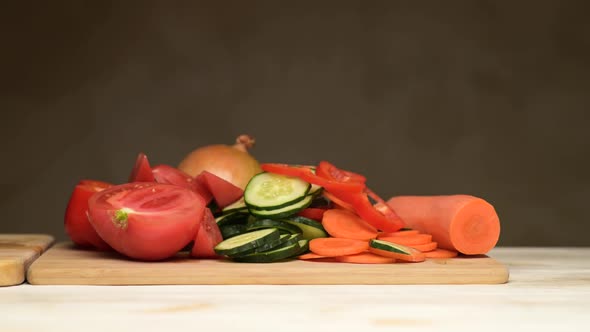 Fresh vegetables push raw meat to the side, competing with it