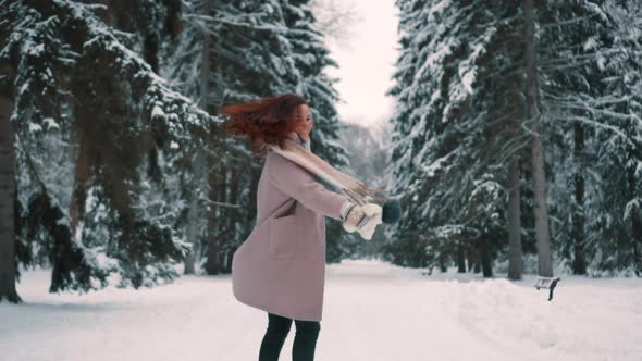 Joyful Female Whirl in Winter Forest