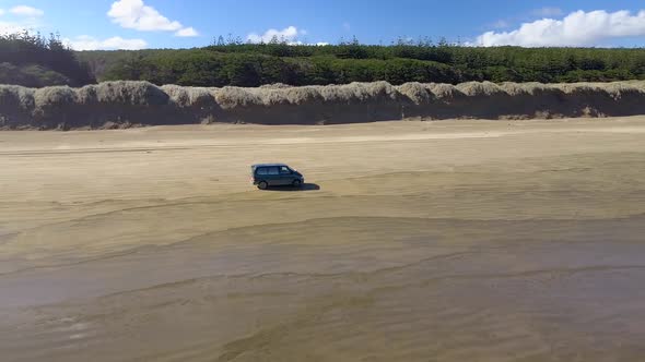 Driving on the beach by the ocean