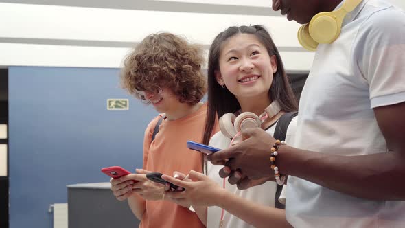 Group of Students Using a Cell Phone