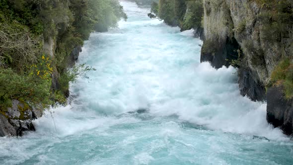 Slow motion of the aggressive river leading up to Huka Falls in New Zealand.