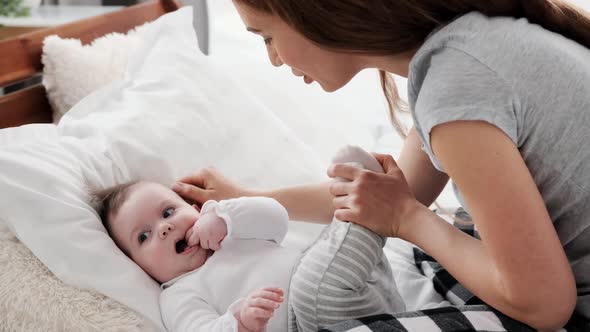 Mother with Child in the Bed