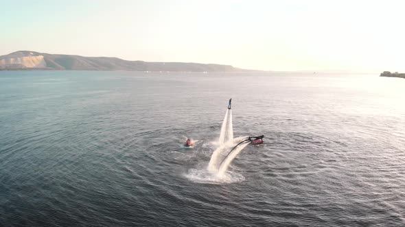 Courageous People Riding Jet Pack Over Water