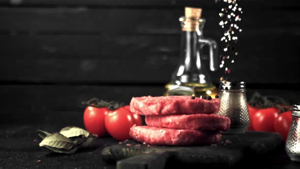 Super Slow Motion on a Bunch of Raw Burger Drop Spices