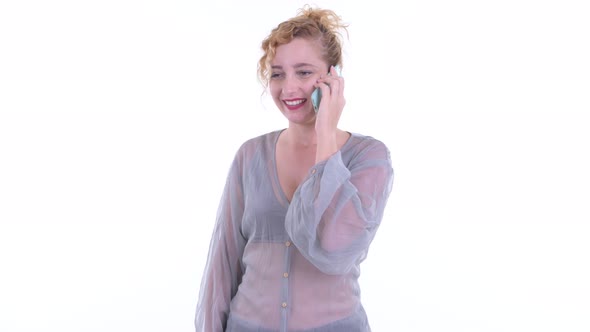 Happy Beautiful Blonde Woman Talking on the Phone