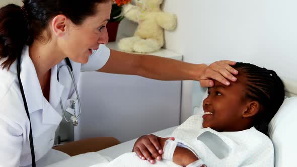 Female doctor examining a sick girl