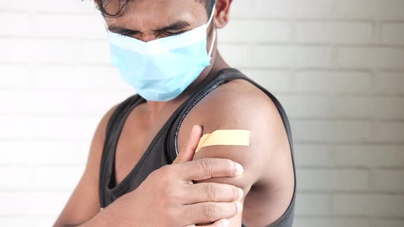 Adhesive Bandage on Young Man's Arm