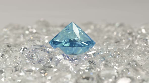 Blue Diamonds Placed On A Pile Of White Diamonds