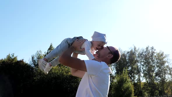 Dad with His Daughter in His Arms