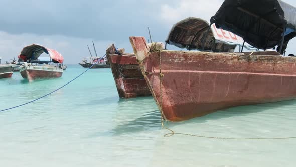 A Lot of Old Wooden African Boat is Anchored in Turquoise Waters of Indian Ocean