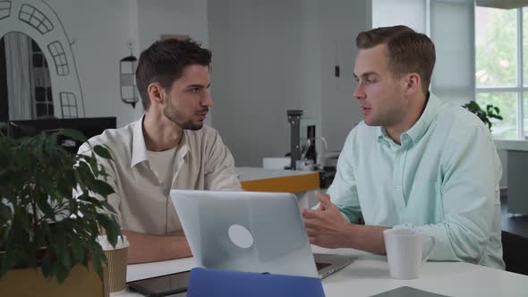 Handsome Casual Business Team in Informal Office Are Chatting and Laughing