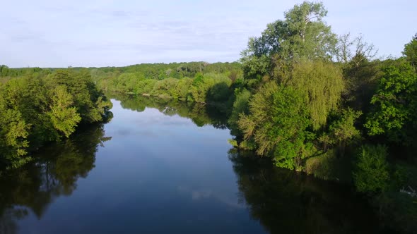 Aerial Drone View Flight Over Mirror Smooth Surface of River and Trees