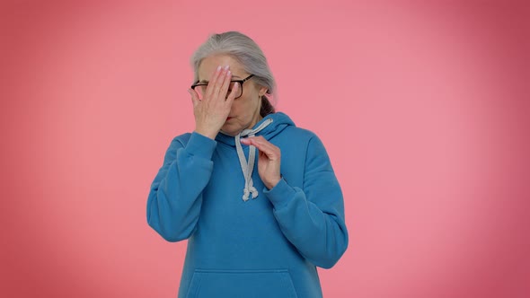 Elderly Granny Old Woman Closing Eyes with Hand Showing Stop Gesture Confused Shy Scared to Watch