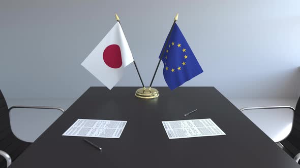 Flags of Japan and the European Union and Papers