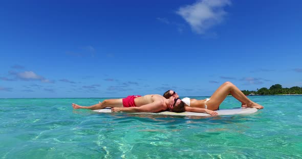 Beautiful people married on vacation spend quality time on beach on summer white sandy background 