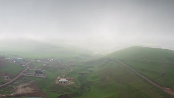 Aerial Flight Over the Residential Sector with Private Houses Under Construction in Green Hills in