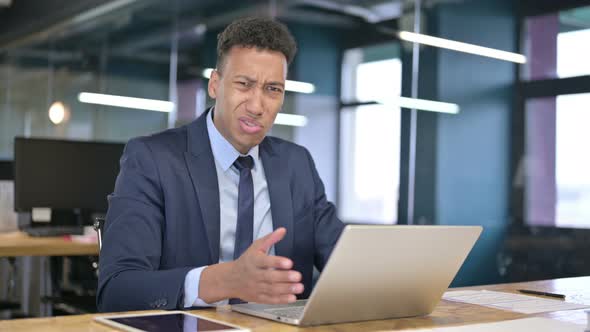 Serious Young Businessman Saying No By Head Shake in Office 