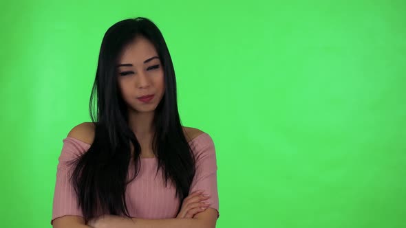 Young Attractive Asian Woman Disagrees (Move with Head on No) - Green Screen Studio