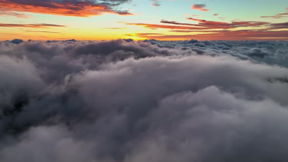 Flight at Dawn Over Dense Clouds