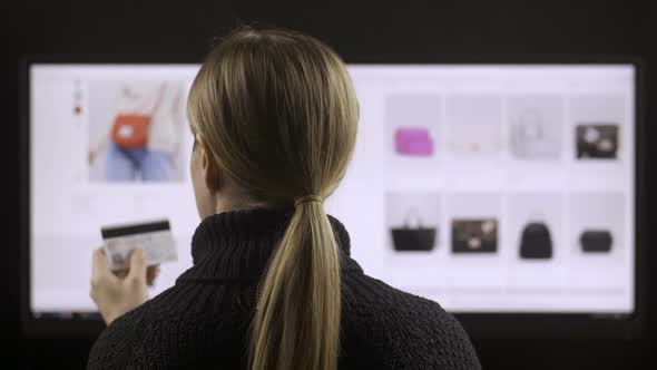 Woman Buying Online on Wide Screen Computer