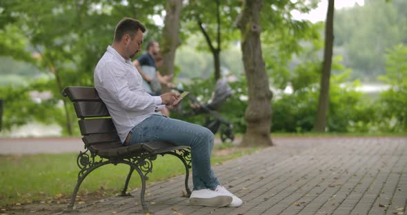 Using Tablet In The Park