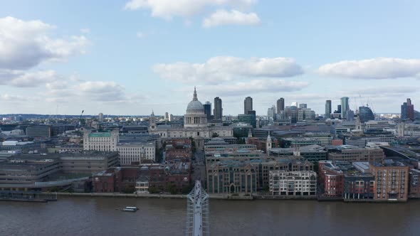 Descending Shot of Thames River Waterfront at Millennium Bridge