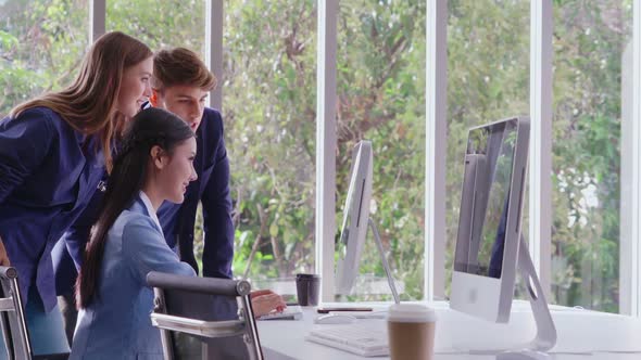 Businesswoman and Businessman Having Conversation in Modern Office